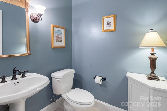 bathroom featuring sink and toilet