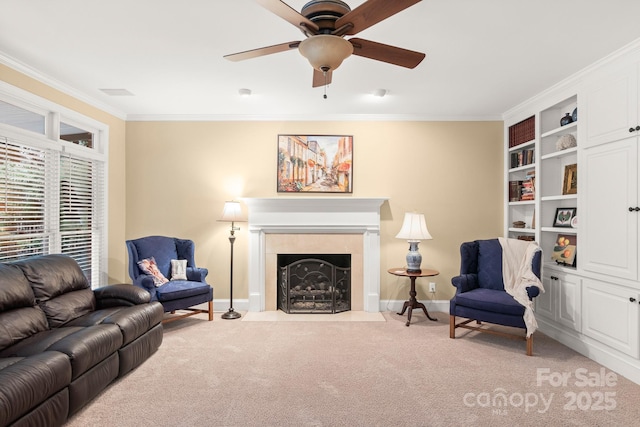 living room featuring light carpet, crown molding, and ceiling fan