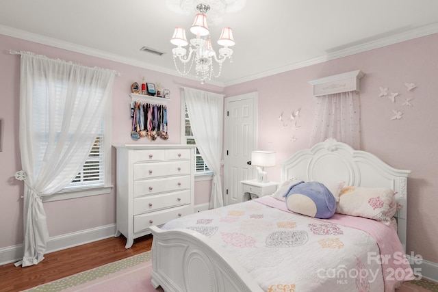 bedroom with crown molding, a chandelier, and light wood-type flooring