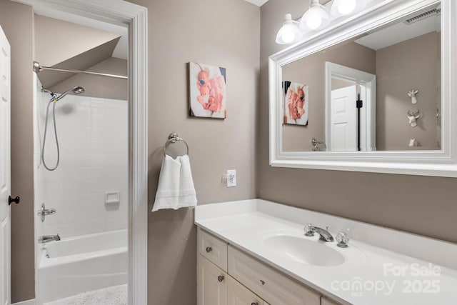 bathroom with vanity and  shower combination