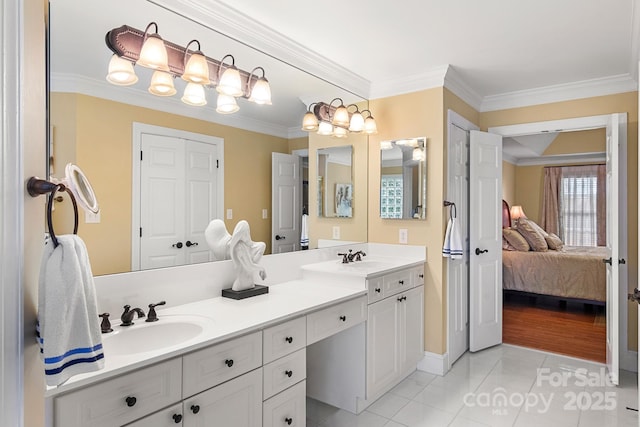 bathroom with vanity, ornamental molding, and tile patterned floors