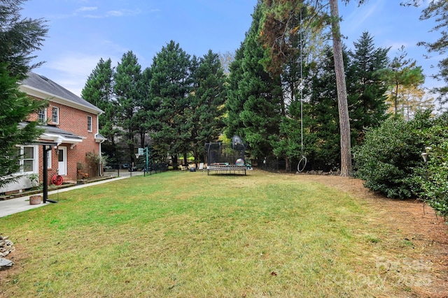 view of yard featuring a trampoline