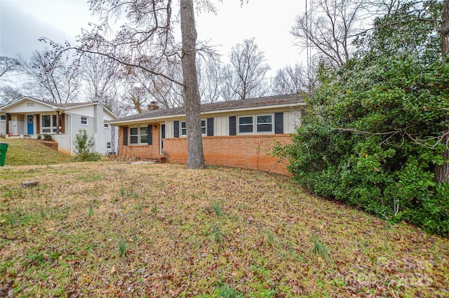 ranch-style home with a front yard