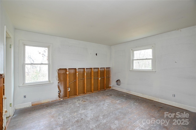 unfurnished room featuring a wealth of natural light