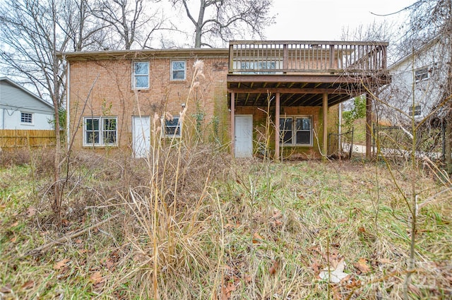 back of house with a deck