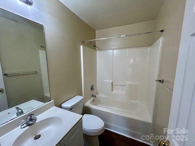 full bath with shower / tub combination, vanity, and toilet