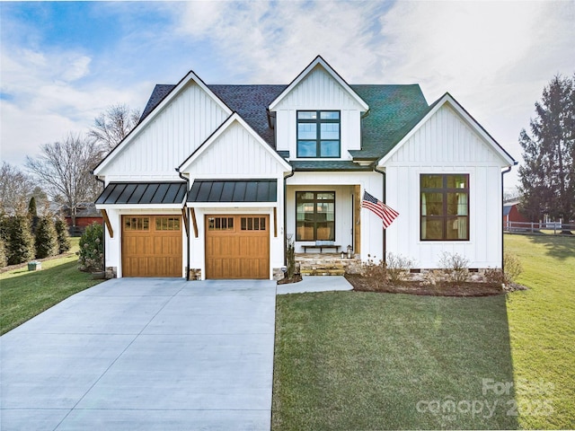 modern farmhouse style home featuring a garage and a front yard