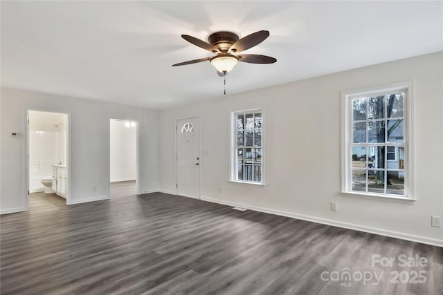 interior space featuring dark hardwood / wood-style flooring, a healthy amount of sunlight, and ceiling fan