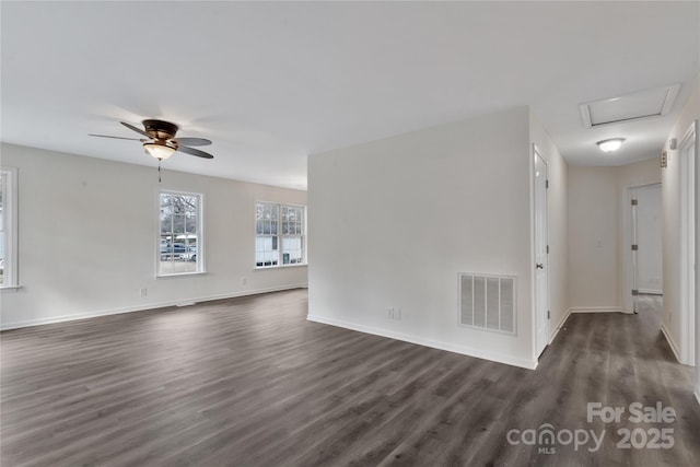 empty room featuring ceiling fan and dark hardwood / wood-style floors