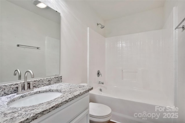 full bathroom with vanity, shower / bathtub combination, and toilet