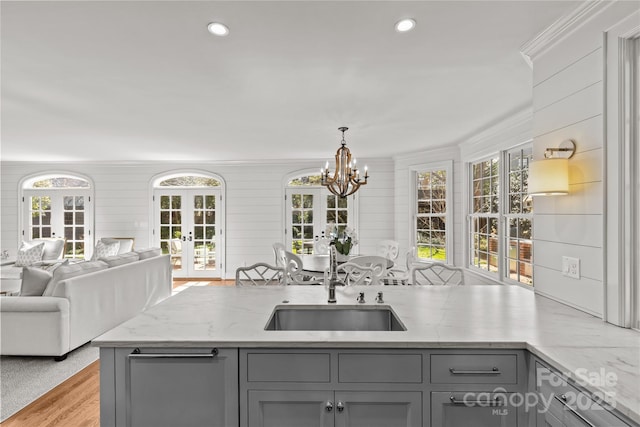 kitchen featuring open floor plan, french doors, and gray cabinets