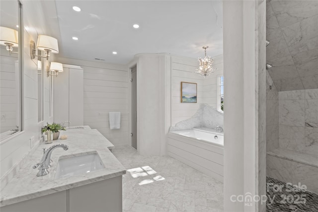 bathroom featuring double vanity, a sink, a tile shower, a bath, and recessed lighting