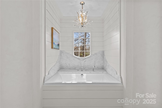 bathroom with a chandelier