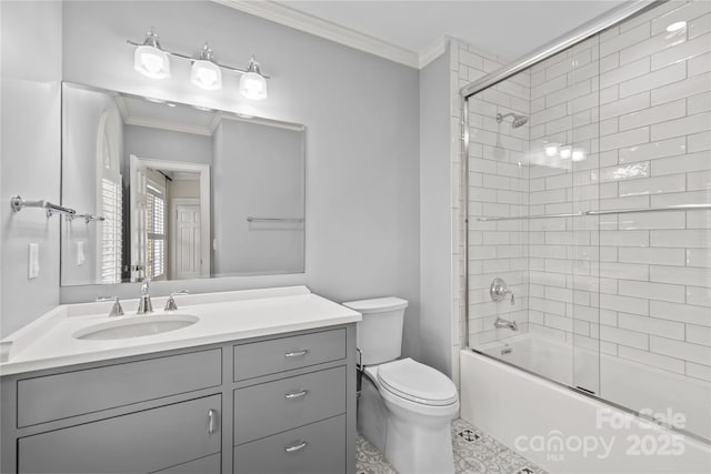 full bath featuring ornamental molding, vanity, toilet, and bath / shower combo with glass door