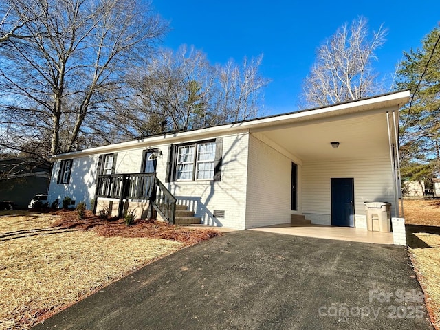 view of front of home with a carport