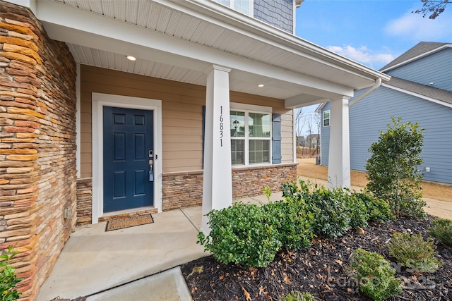 property entrance featuring covered porch