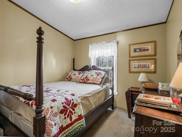 bedroom with a textured ceiling, ornamental molding, and light colored carpet