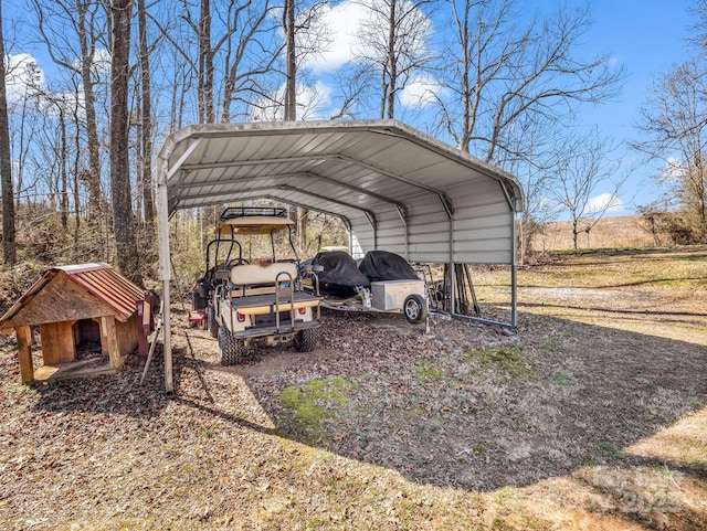 view of parking featuring dirt driveway and a detached carport