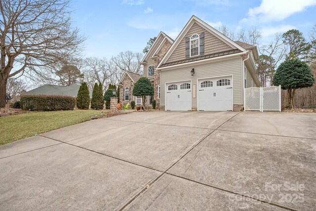 view of property exterior featuring fence, a yard, and concrete driveway