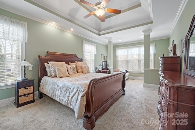 bedroom with ornate columns, ornamental molding, baseboards, and light carpet