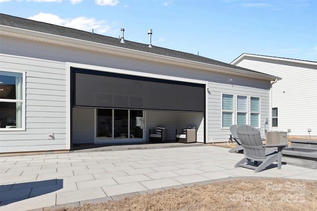 rear view of house featuring a patio area