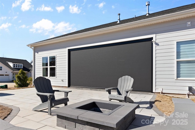 view of patio / terrace with a fire pit