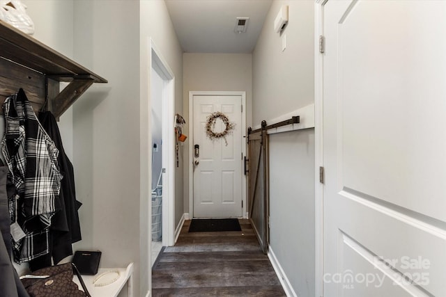 3216 Bridgewick Rd, Waxhaw, NC 28173 - entryway with a barn door, dark wood finished floors, and baseboards