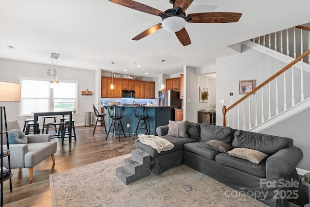 3216 Bridgewick Rd, Waxhaw, NC 28173 - living area with a ceiling fan, stairs, light wood-style flooring, visible vents, and recessed lighting