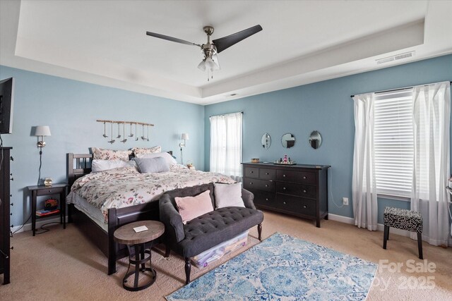 3216 Bridgewick Rd, Waxhaw, NC 28173 - carpeted bedroom with baseboards, visible vents, a raised ceiling, and ceiling fan