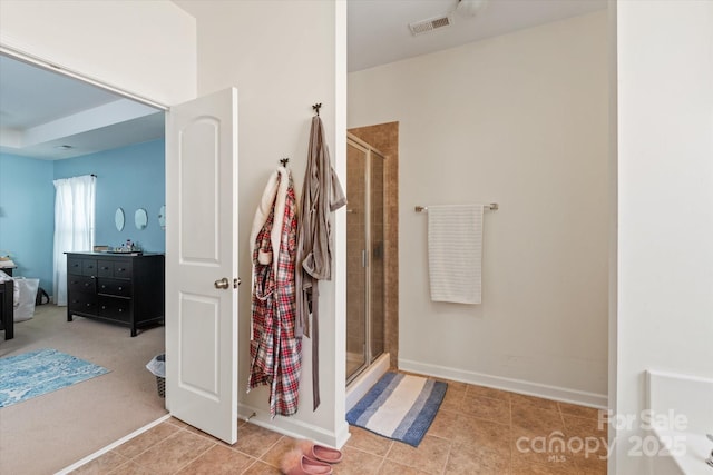 3216 Bridgewick Rd, Waxhaw, NC 28173 - bathroom featuring baseboards, visible vents, tile patterned floors, and a stall shower