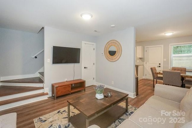 living room with dark hardwood / wood-style flooring