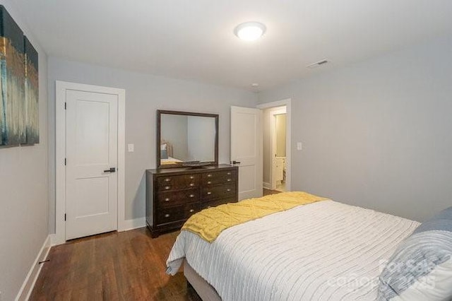 bedroom featuring dark wood-type flooring