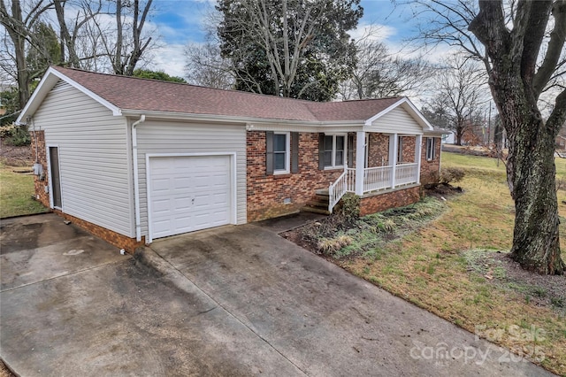 view of front of home with a garage, concrete driveway, brick siding, and a shingled roof