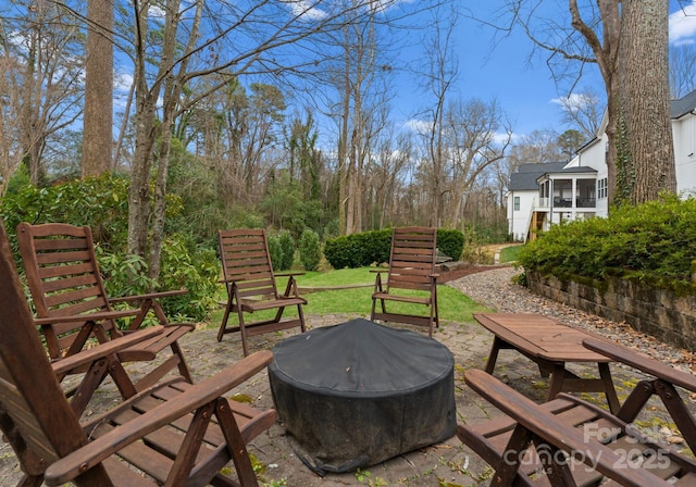 view of patio / terrace featuring an outdoor fire pit