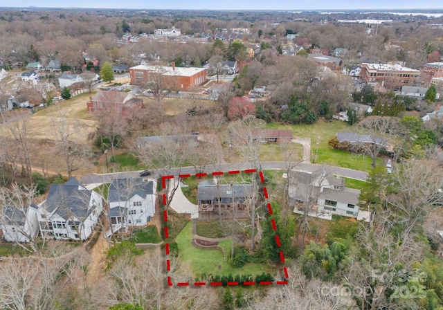 birds eye view of property with a residential view