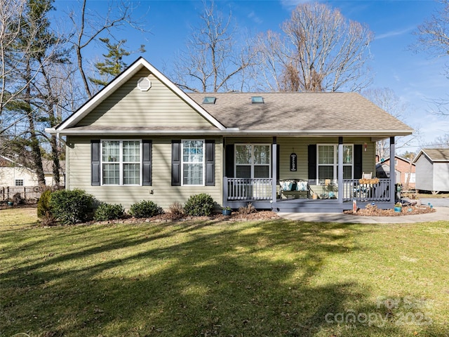 back of house with a yard and covered porch