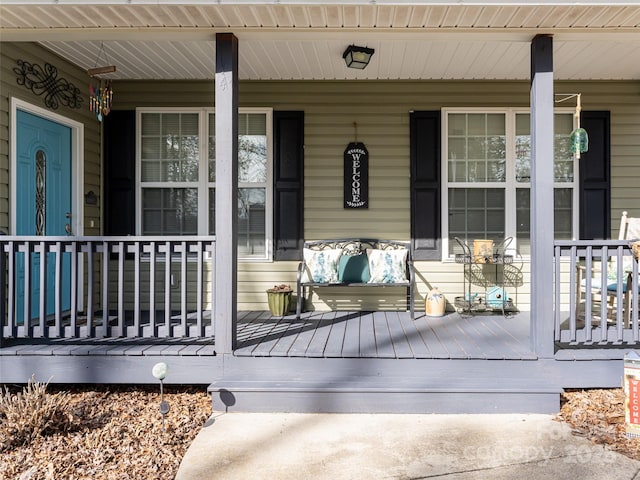 wooden deck featuring covered porch