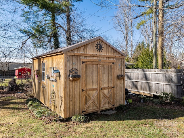 view of outbuilding featuring a yard