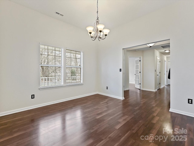 unfurnished dining area featuring an inviting chandelier, baseboards, visible vents, and dark wood-type flooring