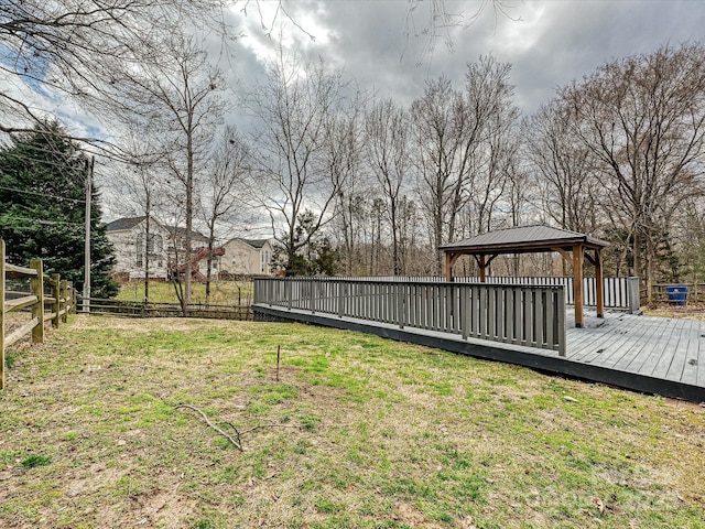 view of yard featuring a gazebo, a fenced backyard, and a wooden deck