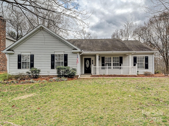 single story home with a porch, roof with shingles, and a front lawn