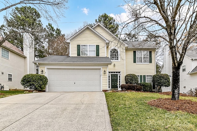 view of property with a garage and a front yard