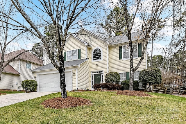 view of front of home with a garage and a front lawn