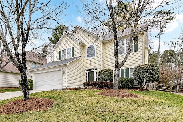 view of front of house with a garage and a front lawn