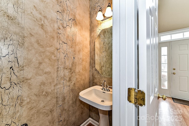 bathroom featuring a healthy amount of sunlight and sink