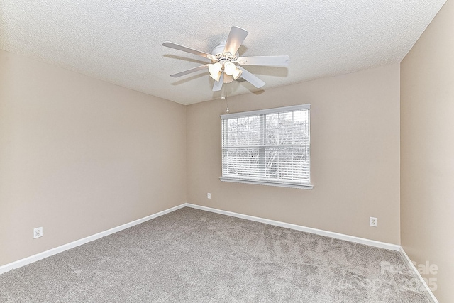 spare room with light carpet, a textured ceiling, and ceiling fan