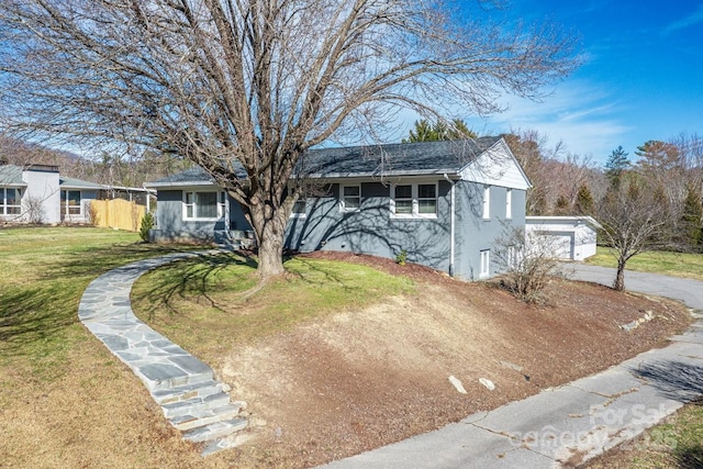 view of front of home with a garage and a front yard