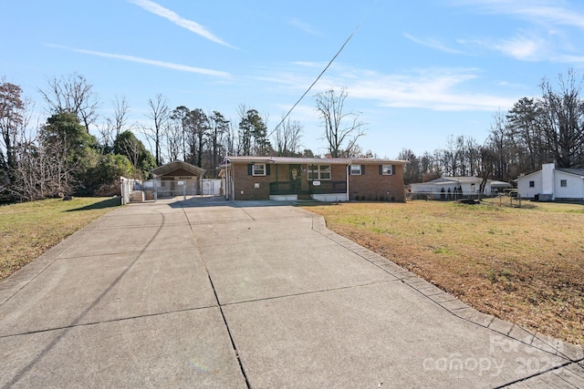 single story home featuring a front yard