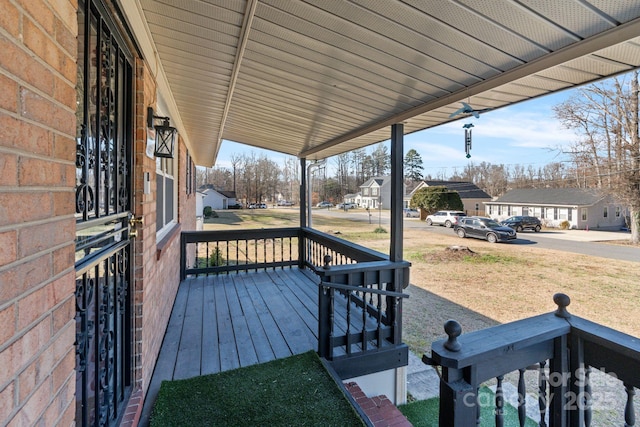 wooden deck featuring covered porch