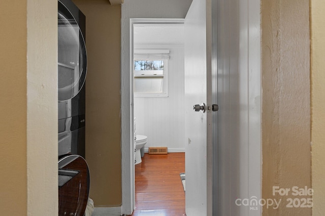 bathroom featuring toilet and wood-type flooring